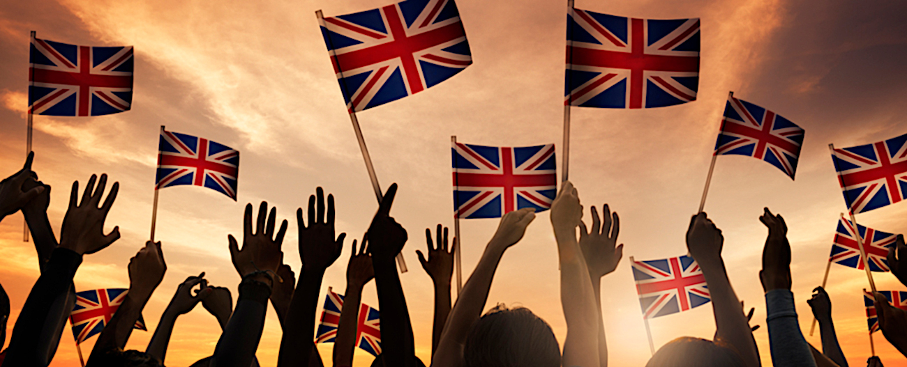 Silhouettes of People Holding National Flag of UK
